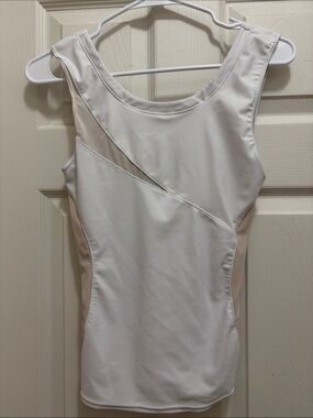 White and Beige Sleeveless Tank Top by Amari Active with sheer cutouts